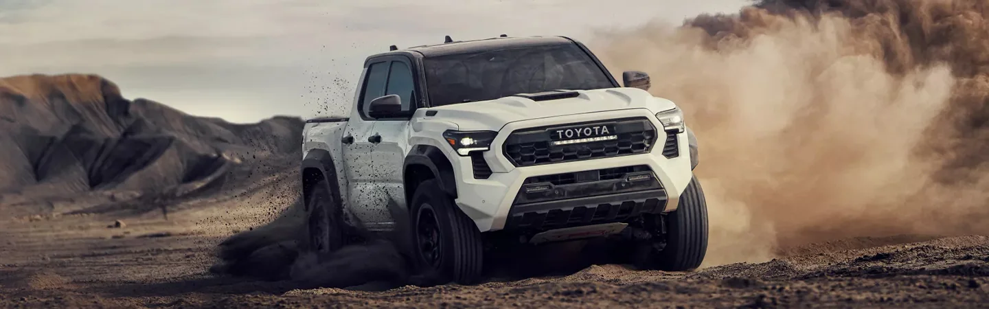 2024 Toyota Tacoma vs 2024 Toyota Tundra front side in white