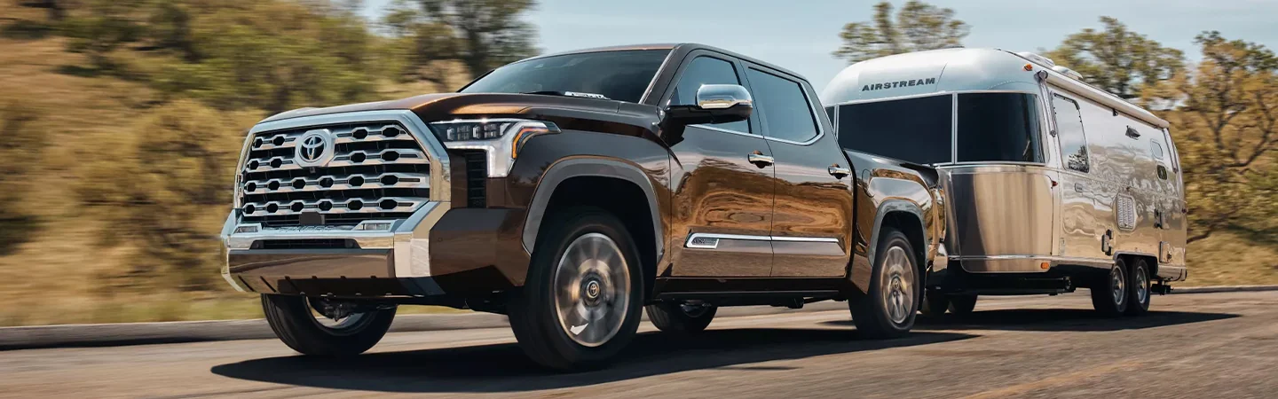 2024 Toyota Tacoma vs 2024 Toyota Tundra front side in brown