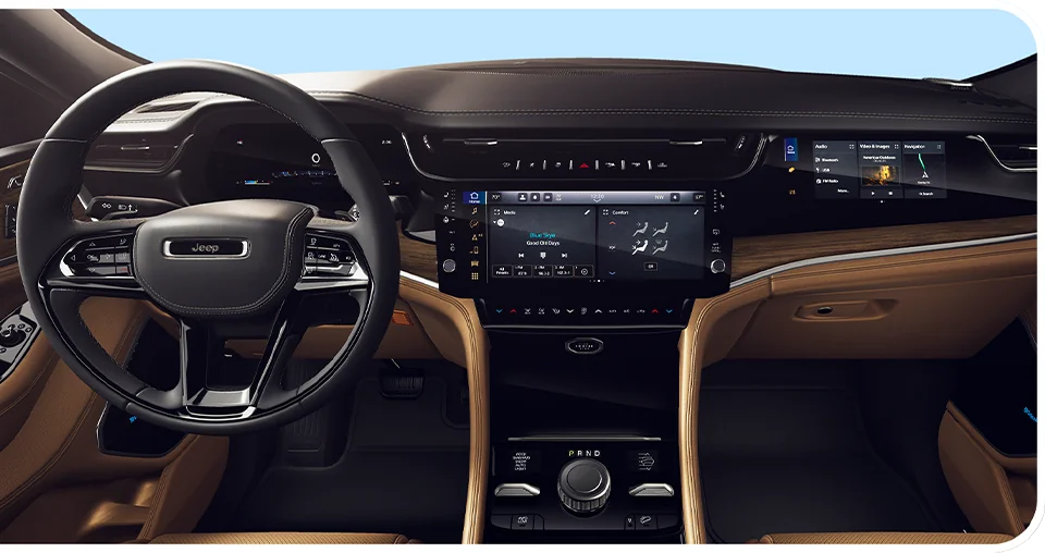 Interor viewof the dashboard and tech of a 2026 Jeep Grand Cherokee