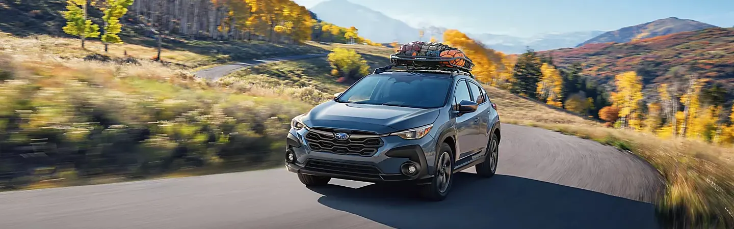 2024 Subaru Crosstrek vs Toyota RAV4 front side view blue