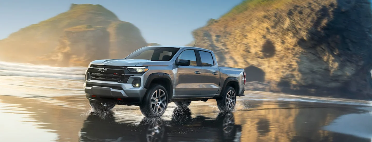 A gray 2024 Chevrolet Colorado parked on the beach