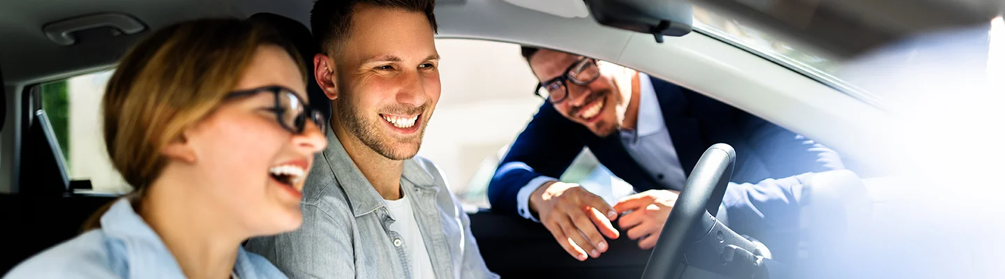 Customers inside a new Kia vehicle