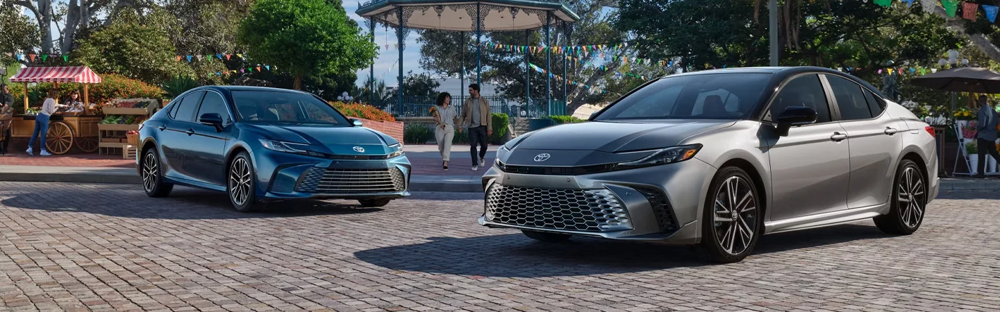 2025 Toyota Camry Specs front side in blue and silver 