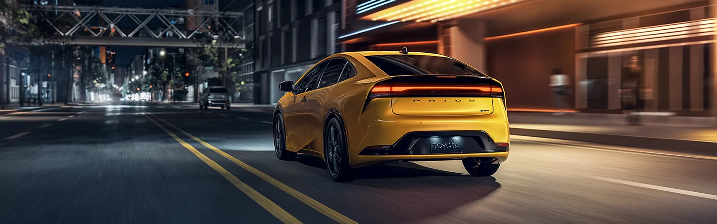 rear of yellow Toyota Prius