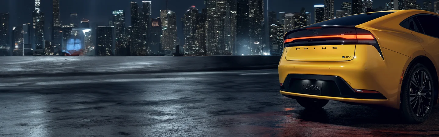 rear of yellow Toyota Prius