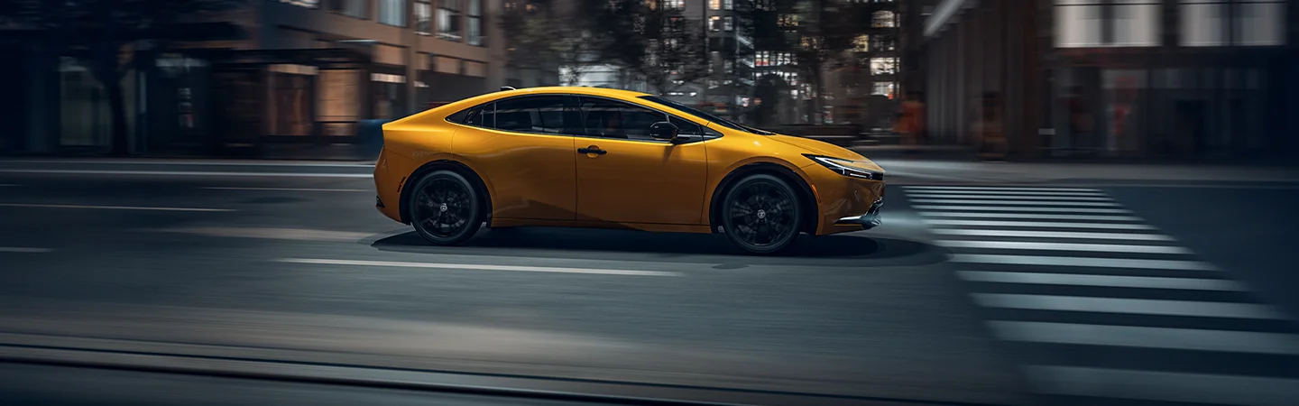 side of yellow Toyota Prius
