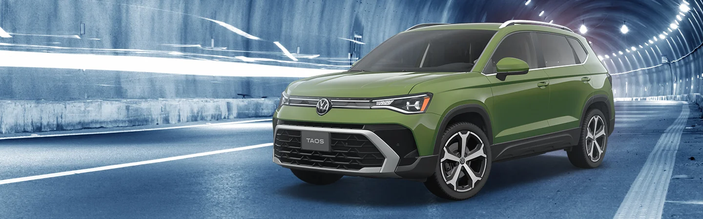 Green 2025 Volkswagen Taos parked in a tunnel