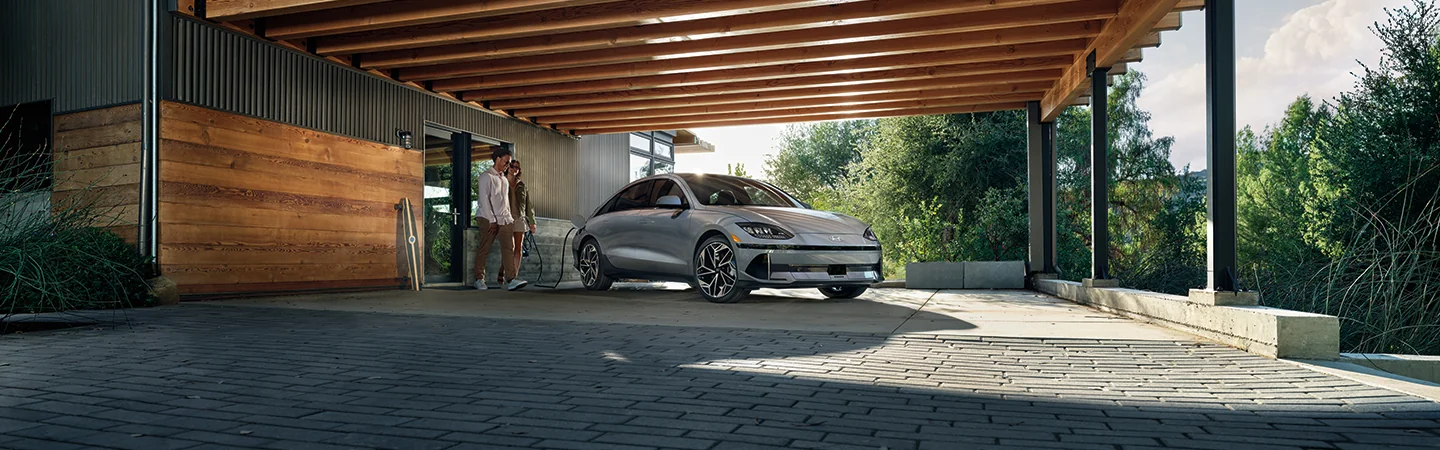 gray 2025 Hyundai IONIQ 6 couple doing charging