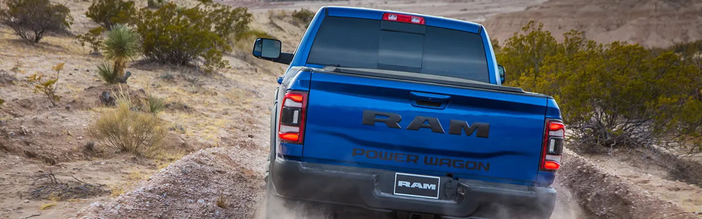 2024 RAM 2500 vs Ford Super Duty front side view red