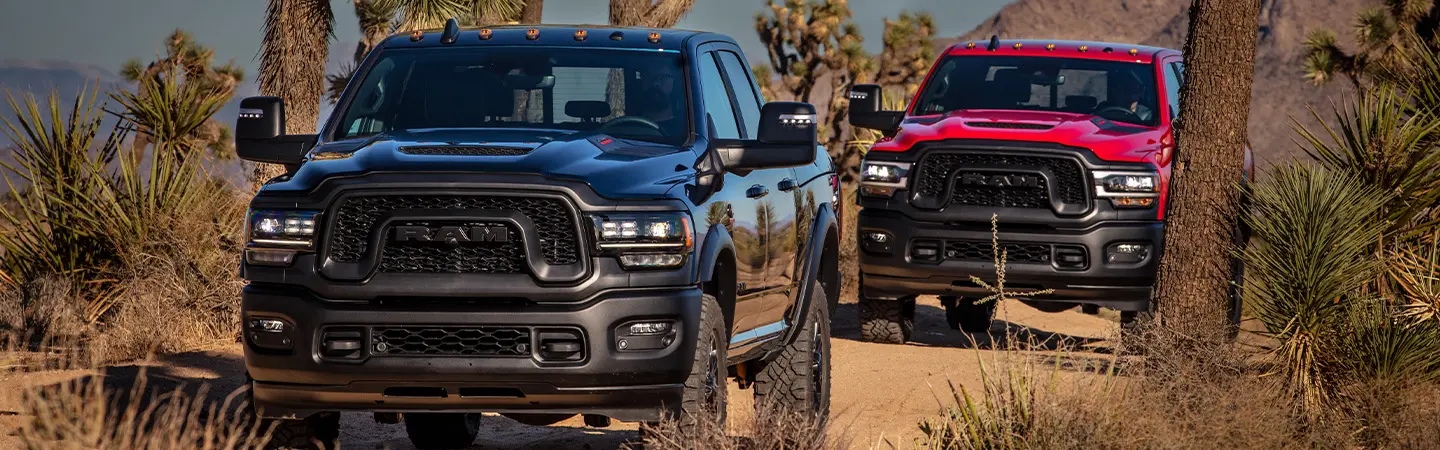 2024 RAM 2500 vs Ford Super Duty front side view red