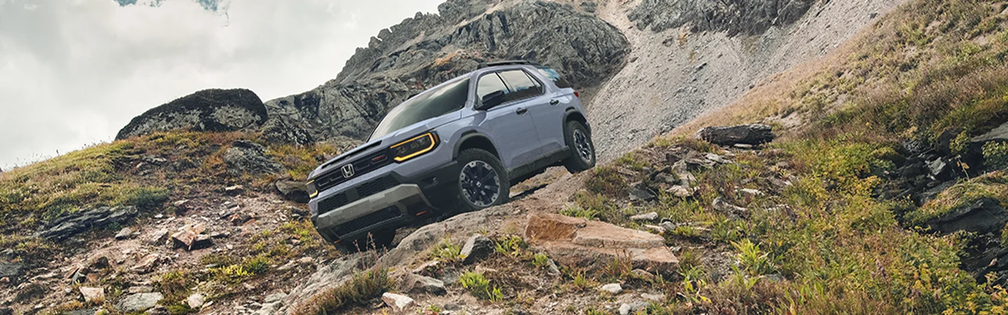 2026 Honda Passport driving on a mountain road