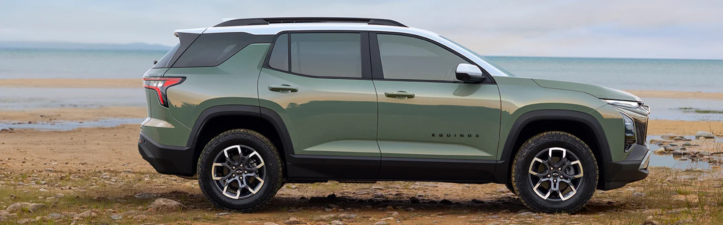 Side view of a parked 2025 Chevrolet Equinox on the beach
