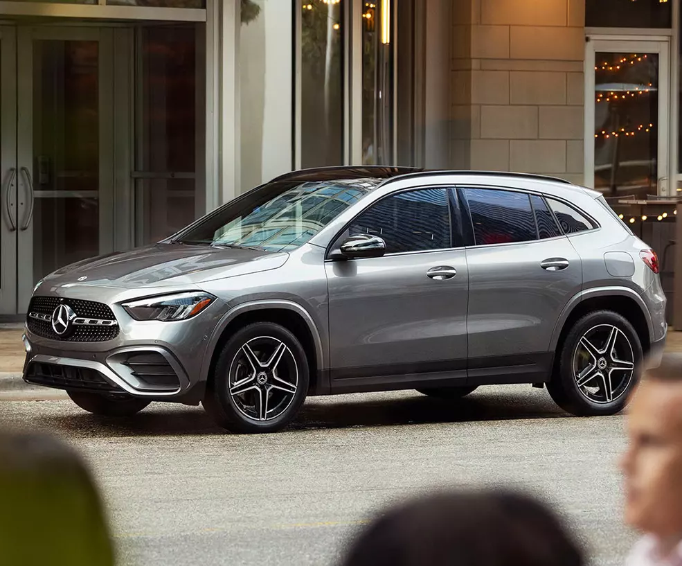 Side view of a parked gray 2026 Mercedes-Benz GLA on a city street