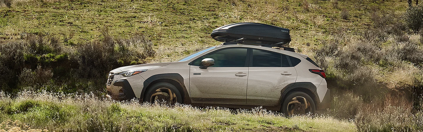 2026 Subaru Crosstrek Hybrid Sport with cargo strapped on top