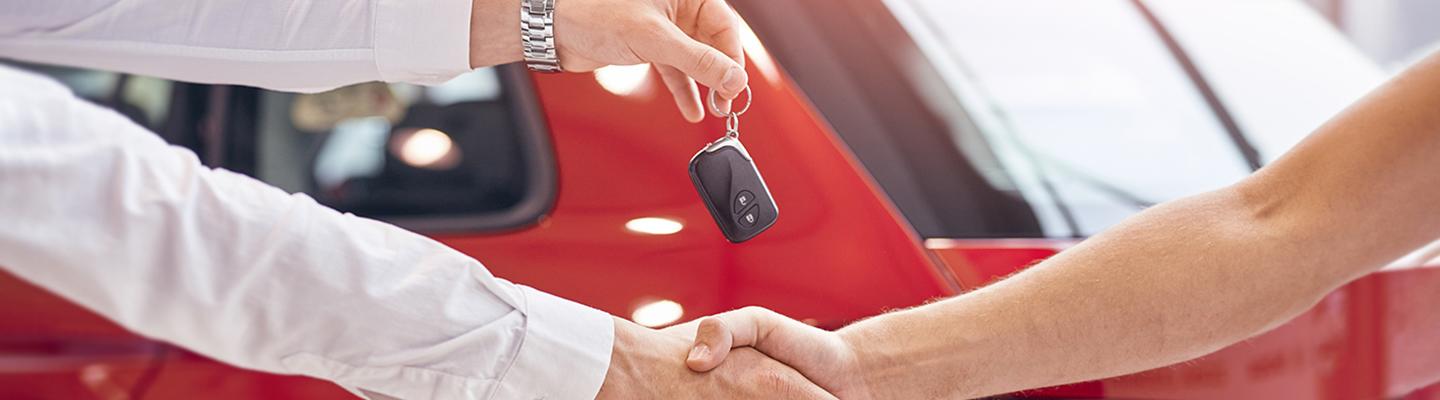 New Ford keys and signing new lease paperwork at our Ford dealership