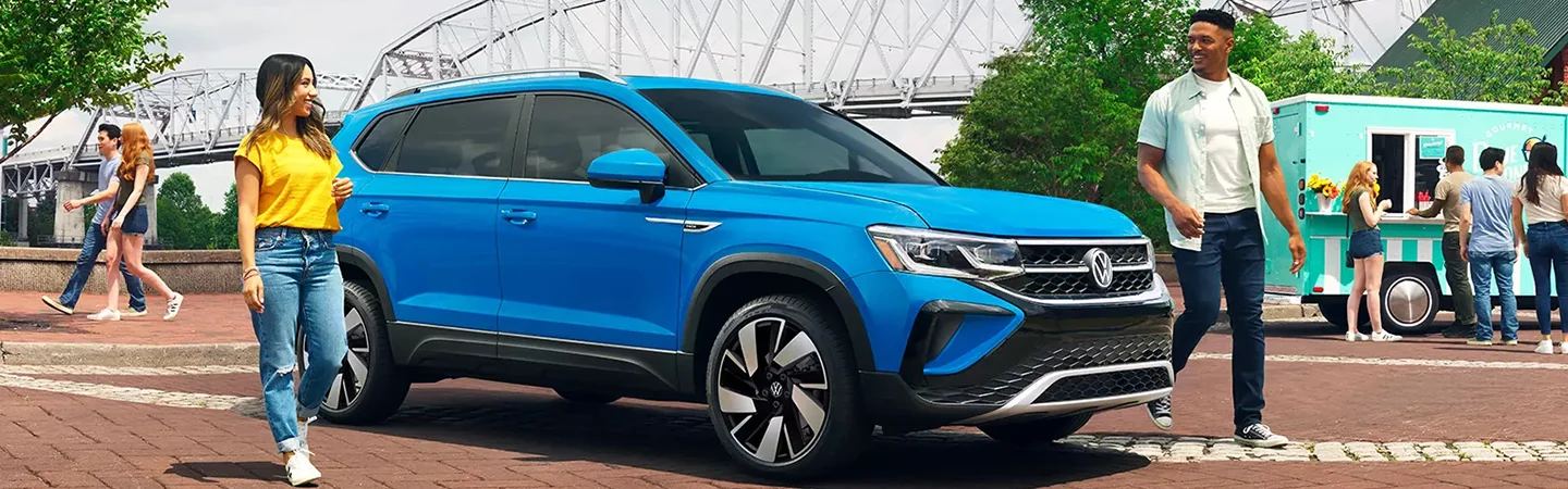 2024 Volkswagen Taos vs Honda CR-V front side blue