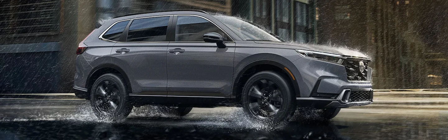 2024 Volkswagen Taos vs Honda CR-V front side silver