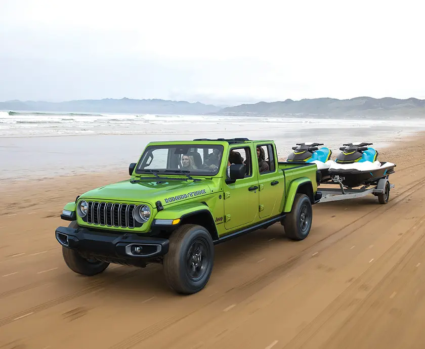 2026 Jeep Gladiator towing Jet Skis on beach