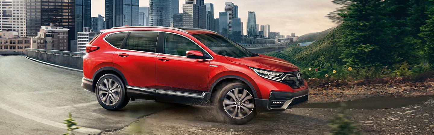 red 2022 Honda CR-V Hybrid heading towards rocky road