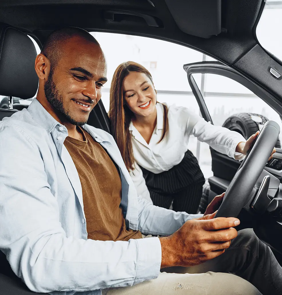 man checking out inside a new car
