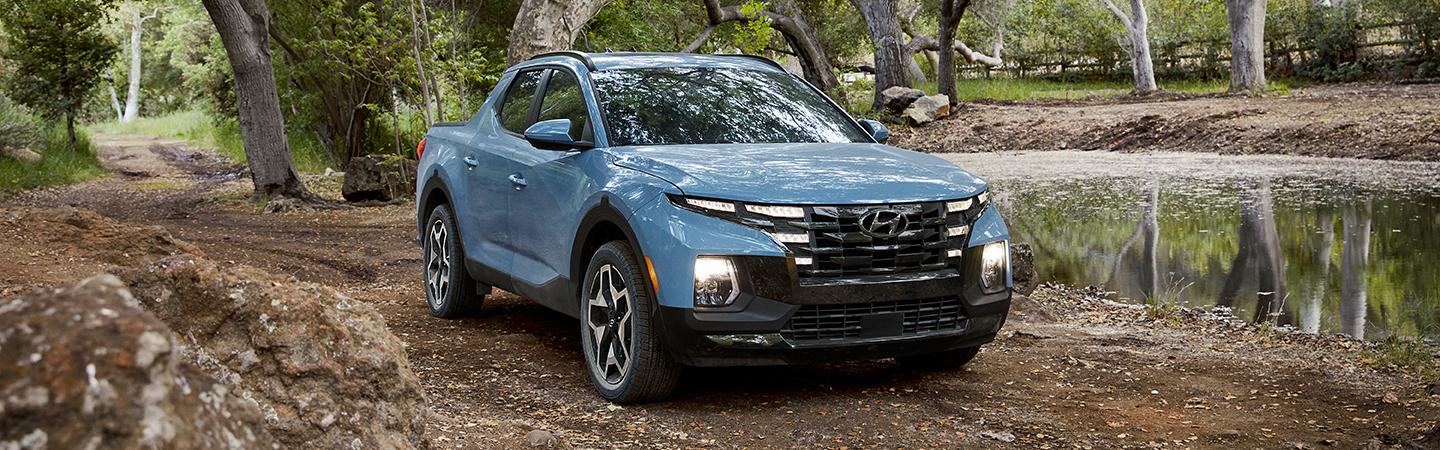 blue 2022 Hyundai Santa Cruz by river
