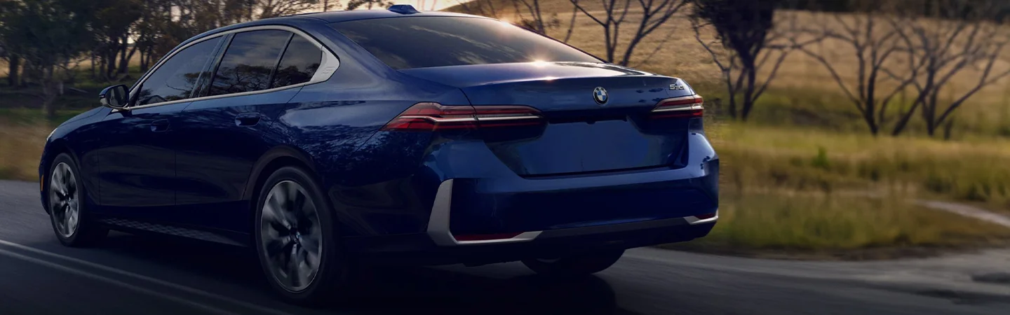 2024 BMW 5 Series back side view blue