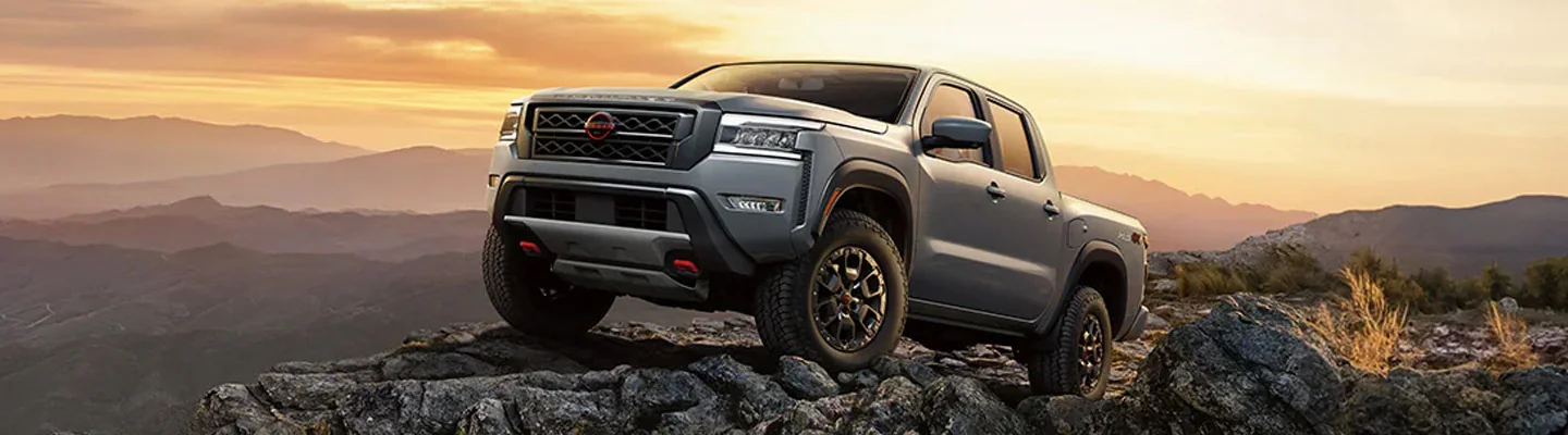 2024 Nissan Frontier parked on some rocks in the wilderness