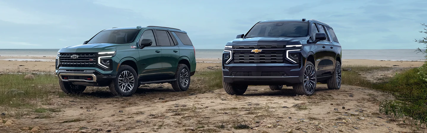 Two 2025 Chevrolet Tahoes parked at the beach 