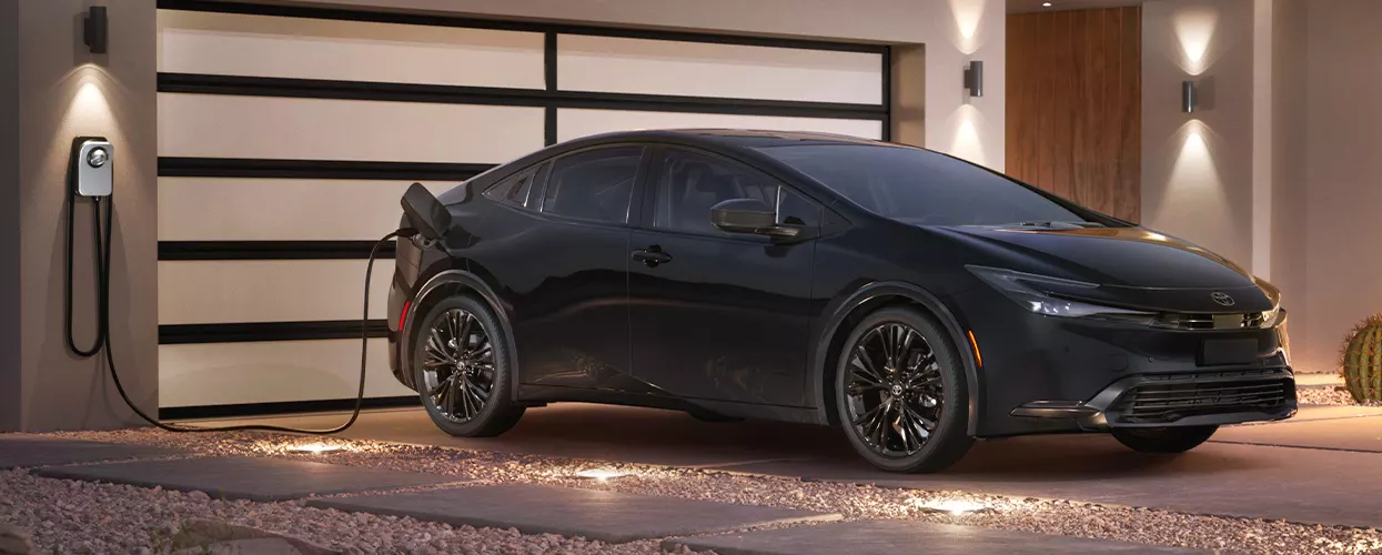 Hybrid Toyota vehicle charging at a home charging port