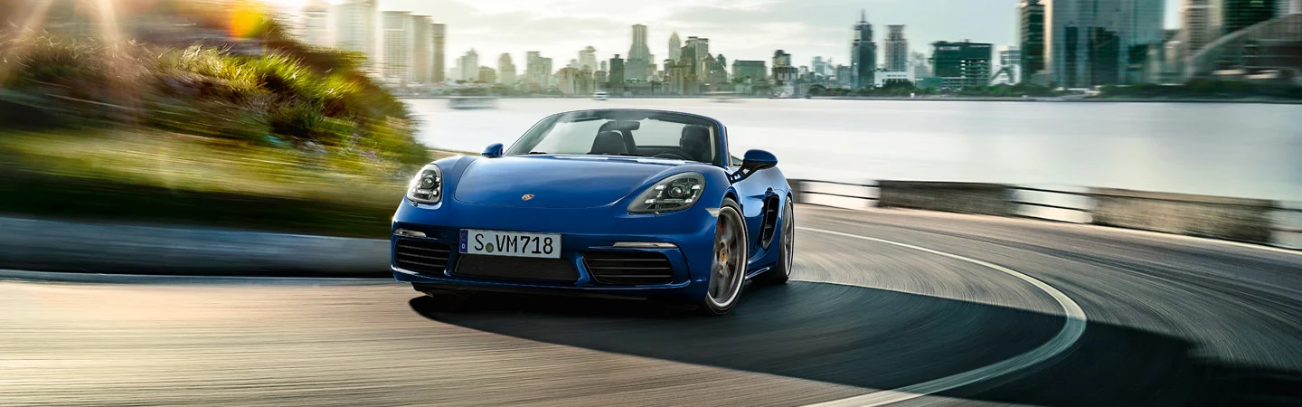 2025 Porsche 718 Cayman Base on windy road in the city