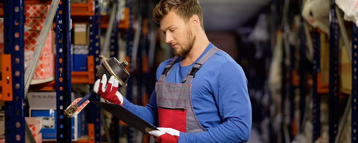 Technician installing genuine off-road accessories on an INEOS Grenadier