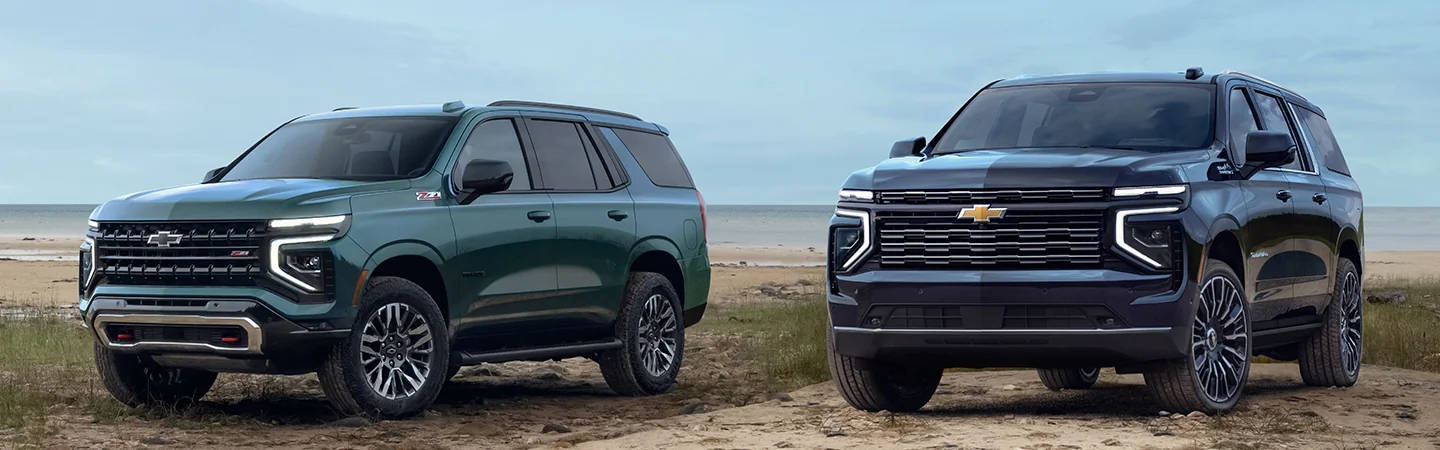 Two 2025 Chevrolet Suburban parked at the beach