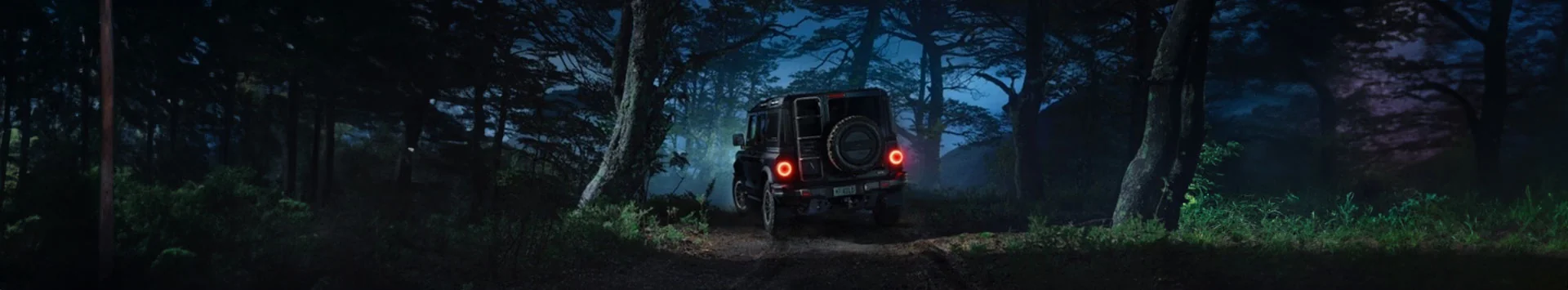 Ineos Trailmaster in woods at night