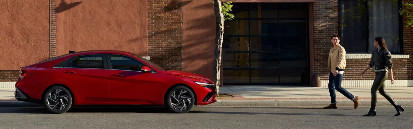 2024 Hyundai Elantra vs Toyota Camry  front side red