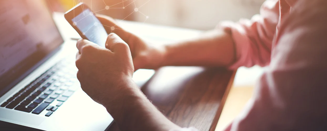 a person on a computer and there phone shopping for a good payment