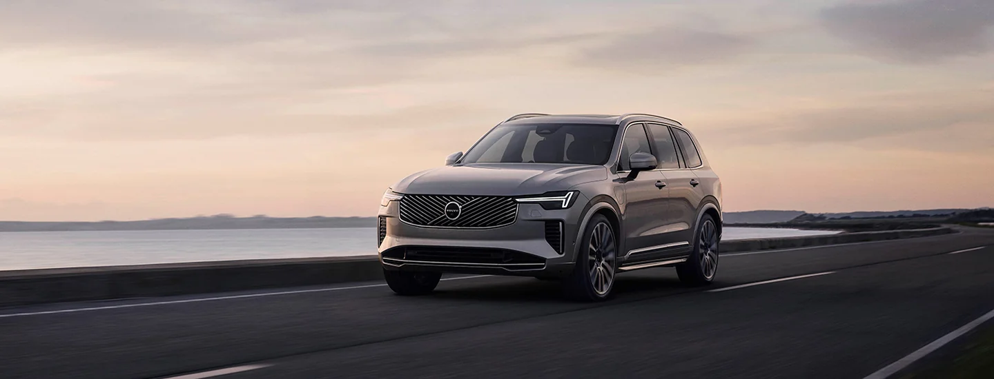 2025 Volvo XC90 driving alongside a beach