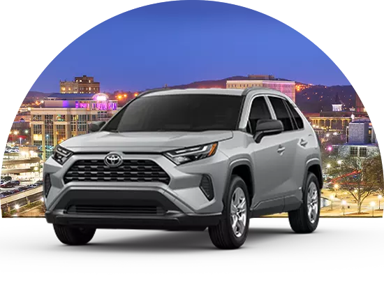 Toyota parked in front of cityscape