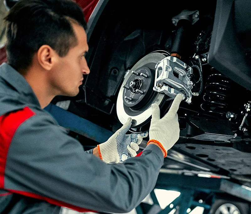 Service tech changing out brake pads