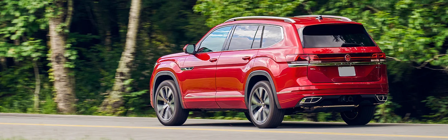 Volkswagen Atlas red color  running on road