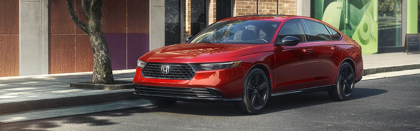 Parked red 2025 Honda Accord on a city street