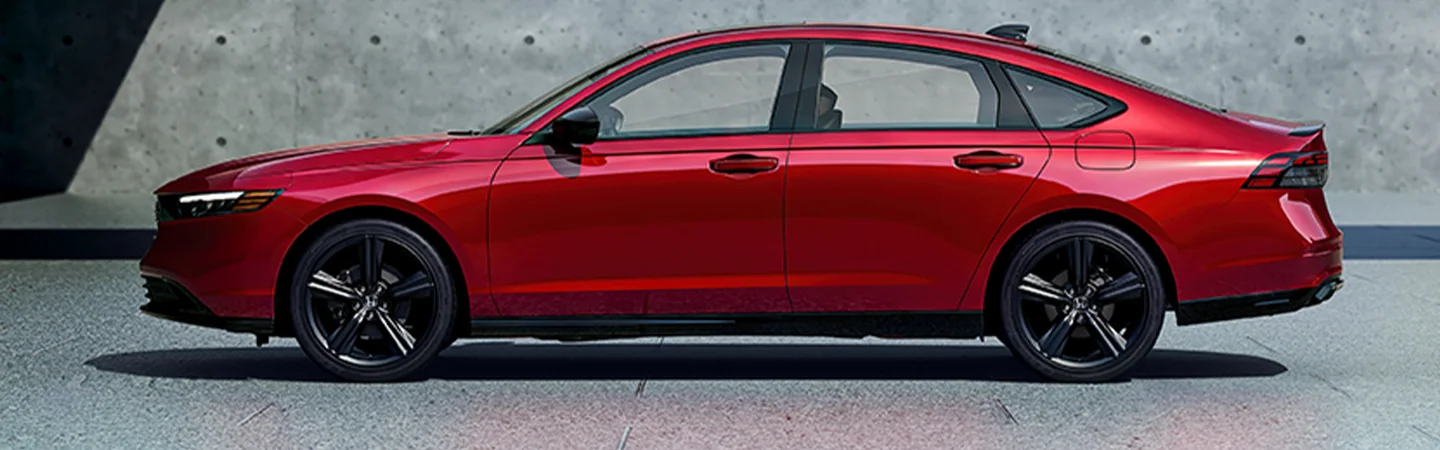 Side view of a parked red 2025 Honda Accord