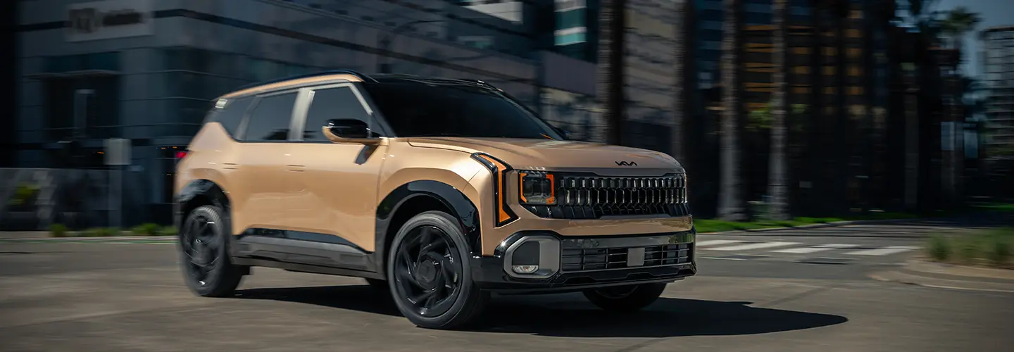 Gold 2027 Kia Seltos on the road