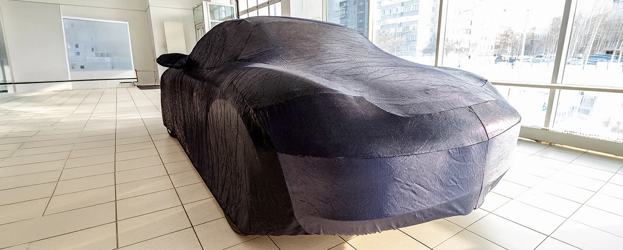 View in a garage of a Lamborghini with a Lamborghini Huracán Outdoor Car Cover