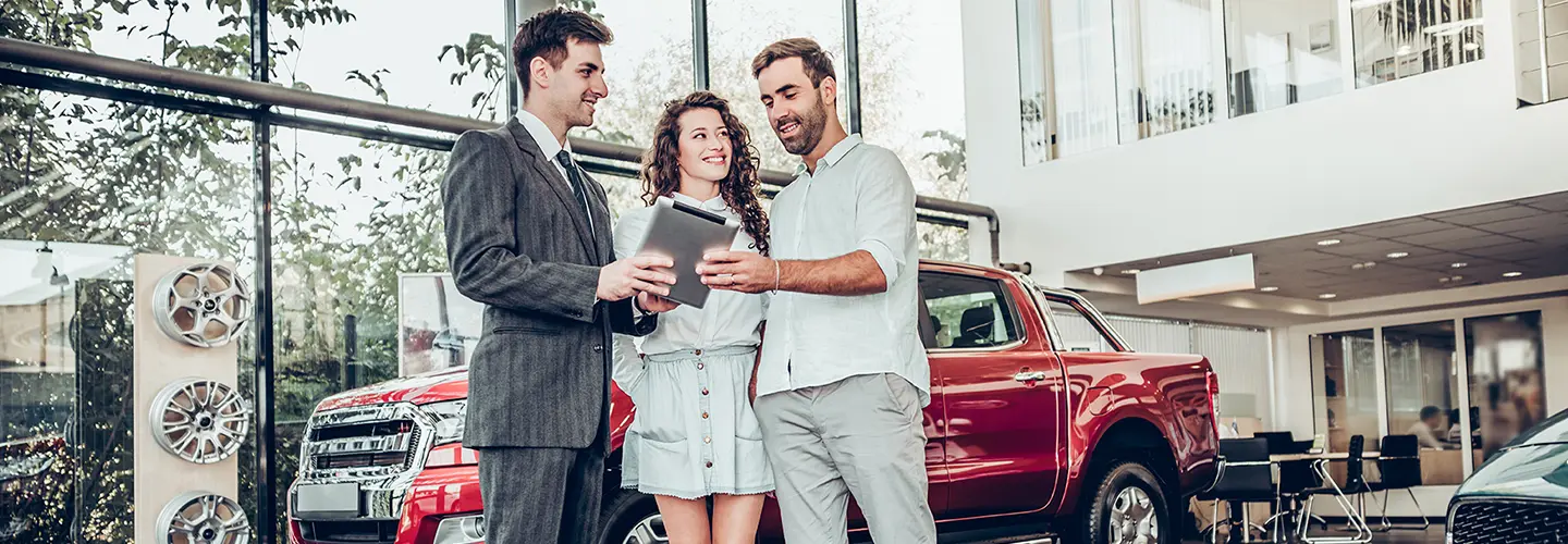 people shopping for a new car at our dealership showroom