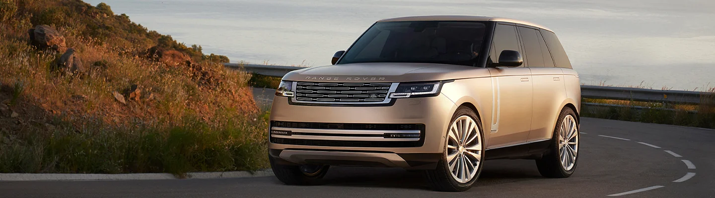 Range rover driving on a road
