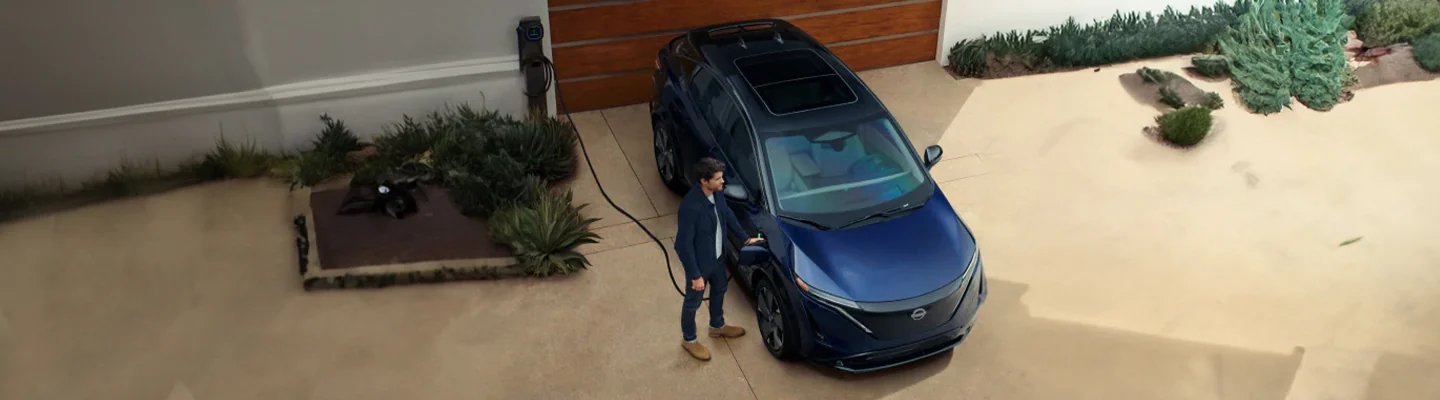 Top view of a Nissan Electric Vehicle being charged