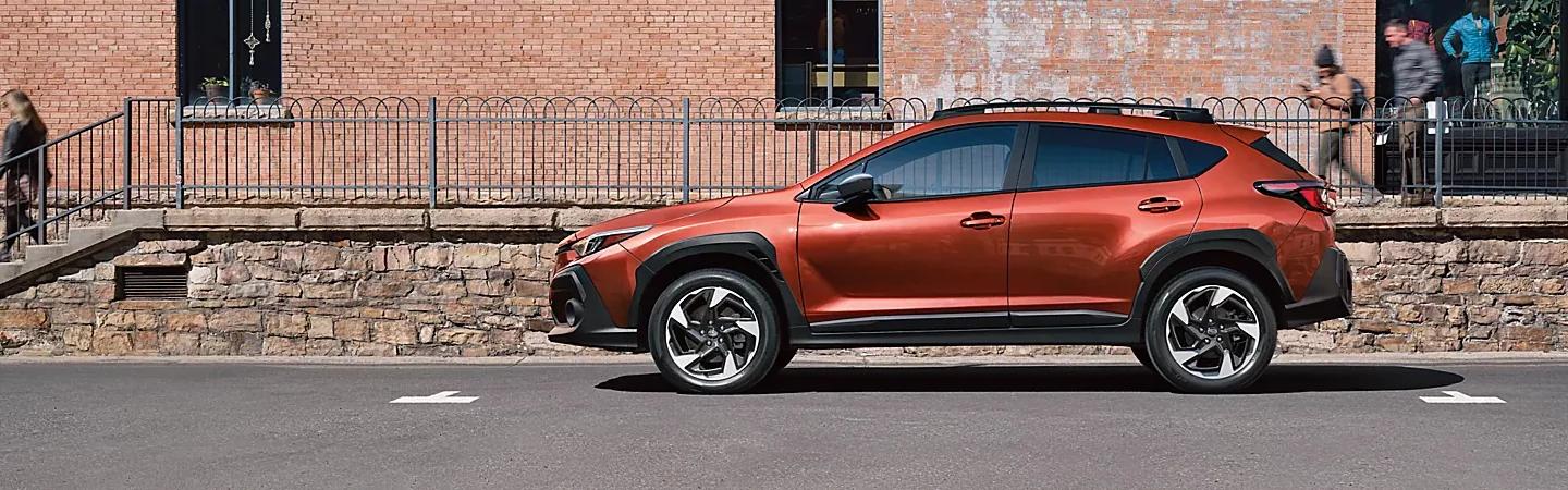2024 Subaru Crosstrek Specs side front in orange