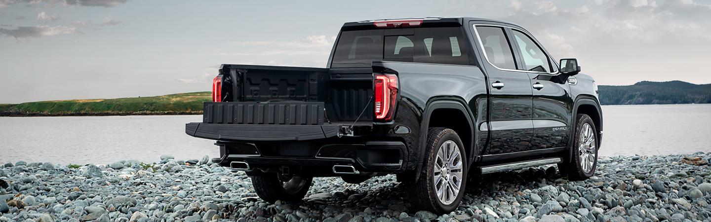 BLACK 2021 GMC SIERRA PARKED BY LAKE