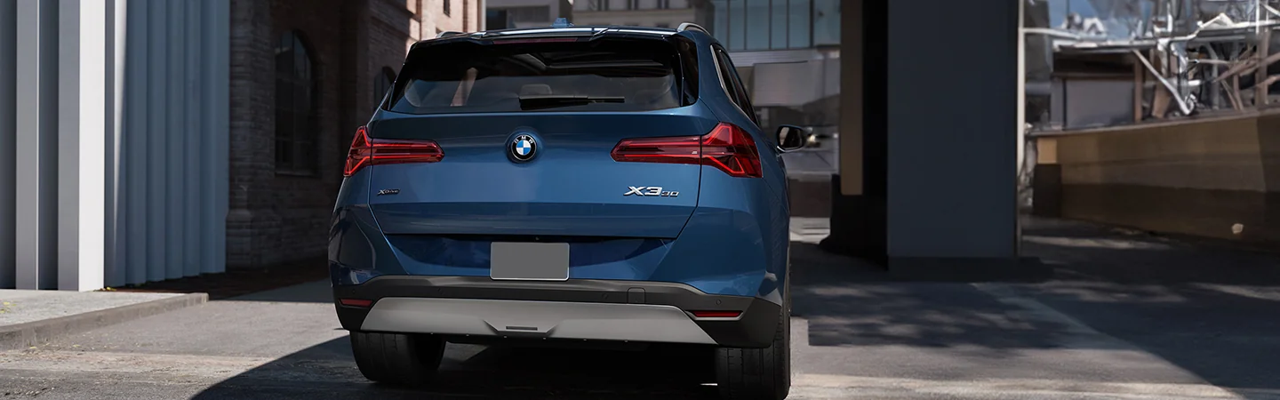 blue 2025 BMW X3 parked in shade