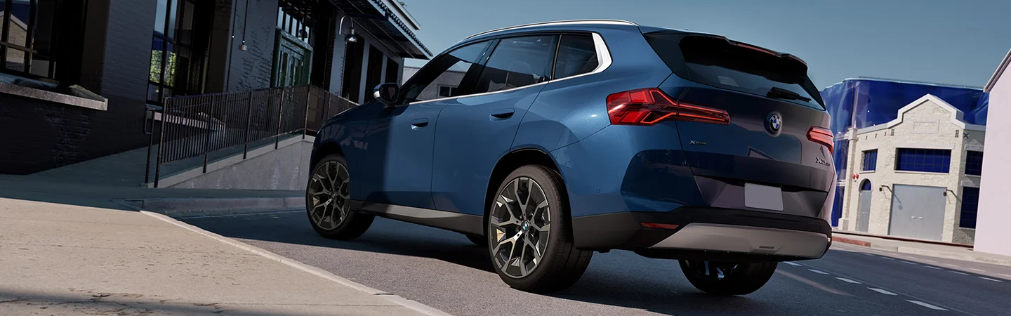 blue 2025 BMW X3 parked back view
